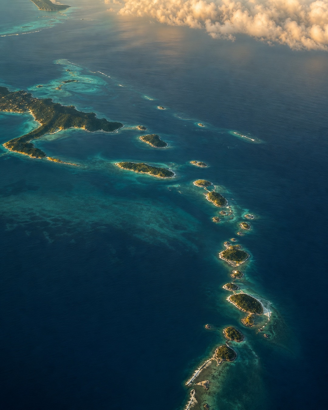 Aerial view of the Caribbean basin — the working territory of Carisam Caribbean Sourcing. Anchored in Jupiter, Florida; serving Bermuda, the Bahamas, Turks & Caicos, Cayman, BVI/SXM, Antigua, Barbados, Trinidad, and Guyana.